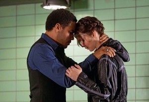 Lenny Kravitz with Jennifer Lawrence in "Hunger Games"