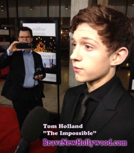 Tom Holland at the Hollywood premiere of "The Impossible," as dad snaps photos. 