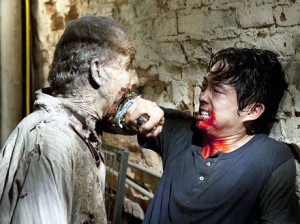 Steven Yeun fights on, AMC's "The Walking Dead"