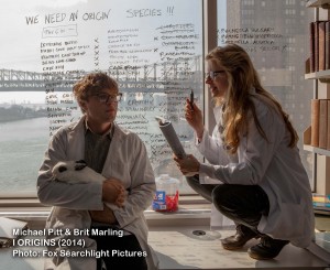 actors Michael Pitt and Brit Marling in lab coats, in I Origins movie still. 