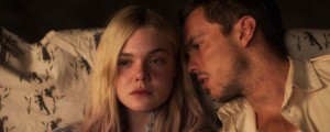 New photos of Elle Fanning and Nicholas Hoult laying side by side in "Young Ones" movie. 