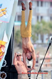 Zac Efron seen doing an impressive hand stand on Robert De Niro's arm in a scene for Dirty Grandpa.