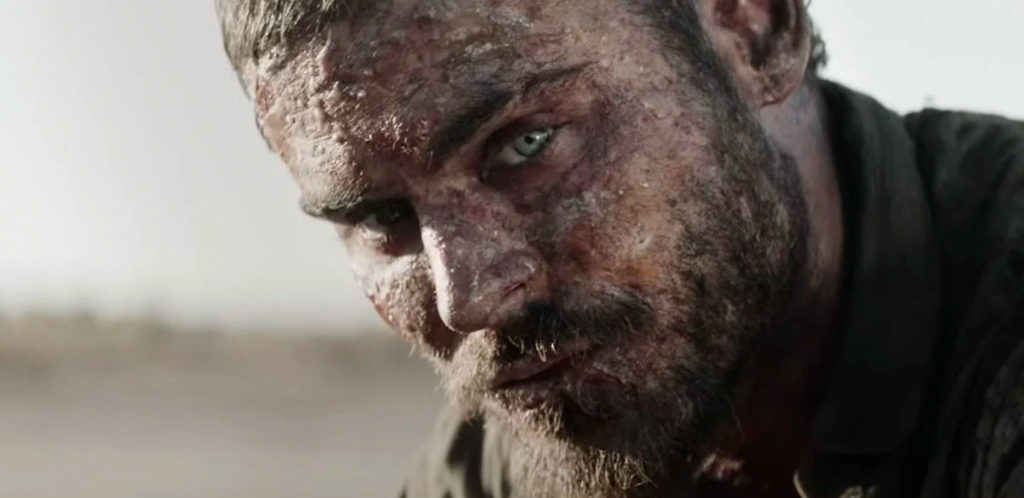 The extremely sunburnt face of Man One (character played by Zac Efron), in GOLD movie.