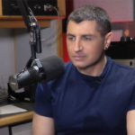 Radio host Vic Gerami behind the microphone during a broadcast