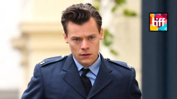 Harry Styles in police uniform in a film still from MY POLICEMAN movie
