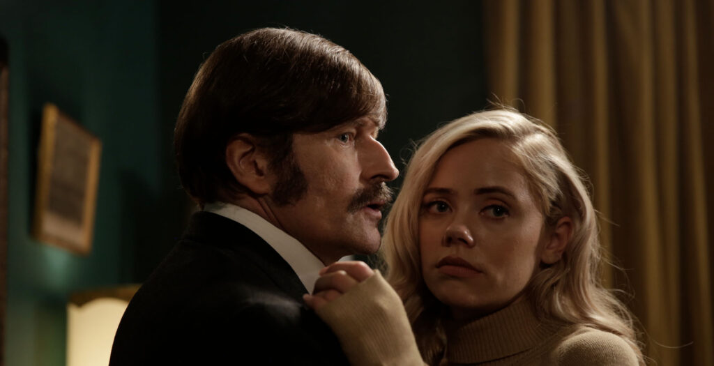 Crispin Glover and Annalisa Cochrane in a close, intimate moment, shown in a mid-chest close-up in A Blind Bargain.