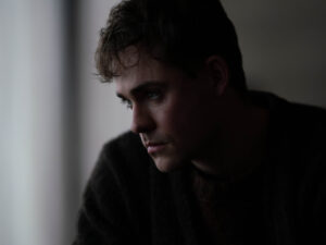 Dacre Montgomery as Jack in the gothic psychological drama Went Up the Hill (2025).
